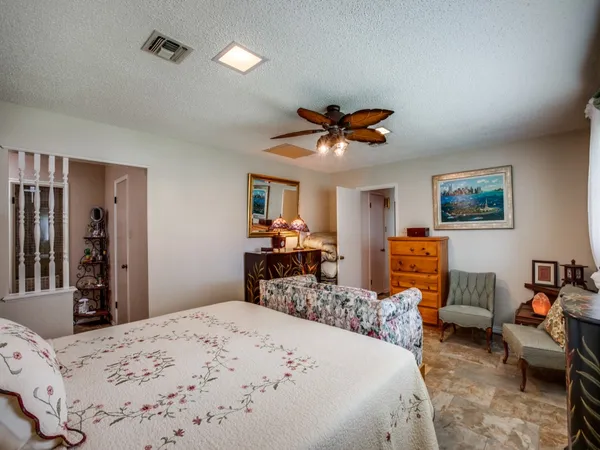 a bed room with a bed and a television