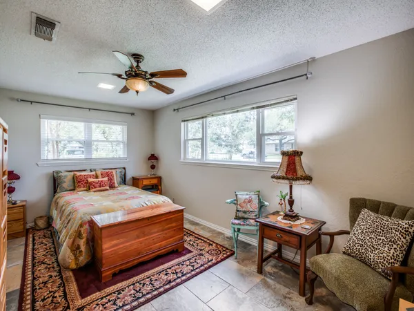 a bed room with a bed and a couch