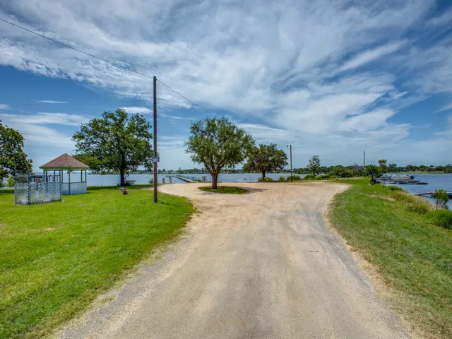 a view of a lake with a yard