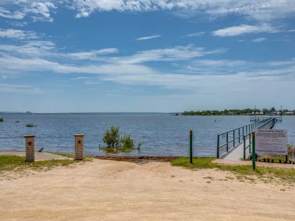 a view of a lake with a house in the background