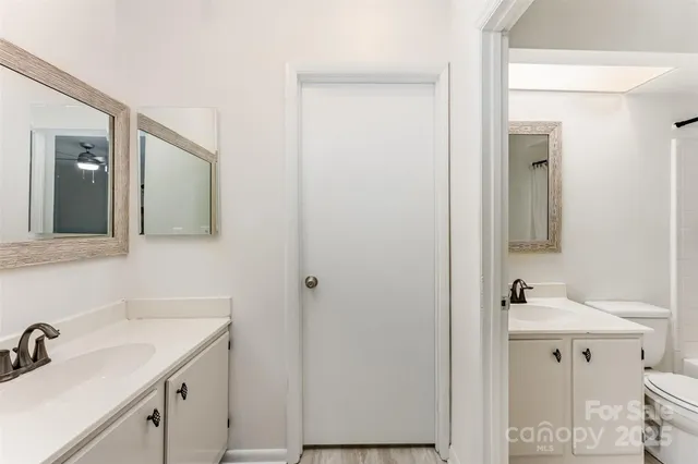 a bathroom with a sink and mirror