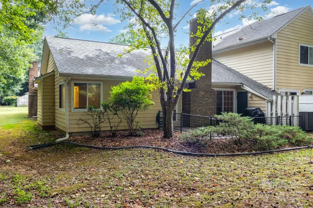 a backyard of a house with lots of green space