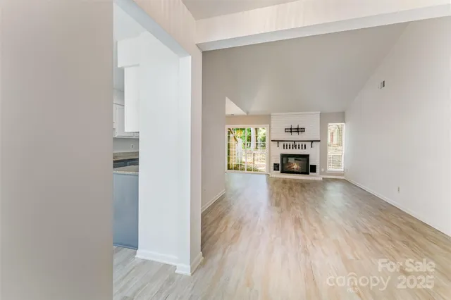 a view of living room with furniture and fireplace