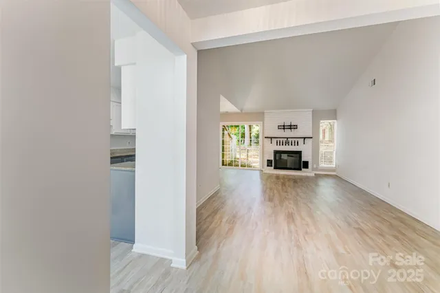 a view of living room with furniture and fireplace