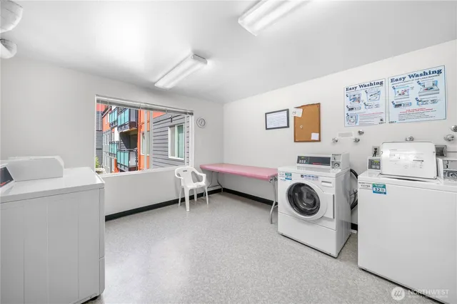 a view of room with window and furniture