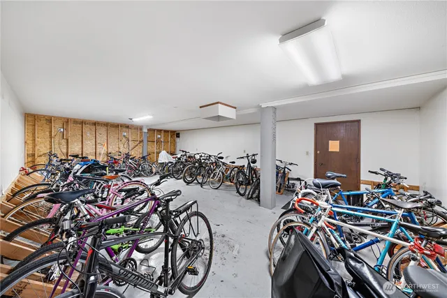 an empty room with closet and wooden floor