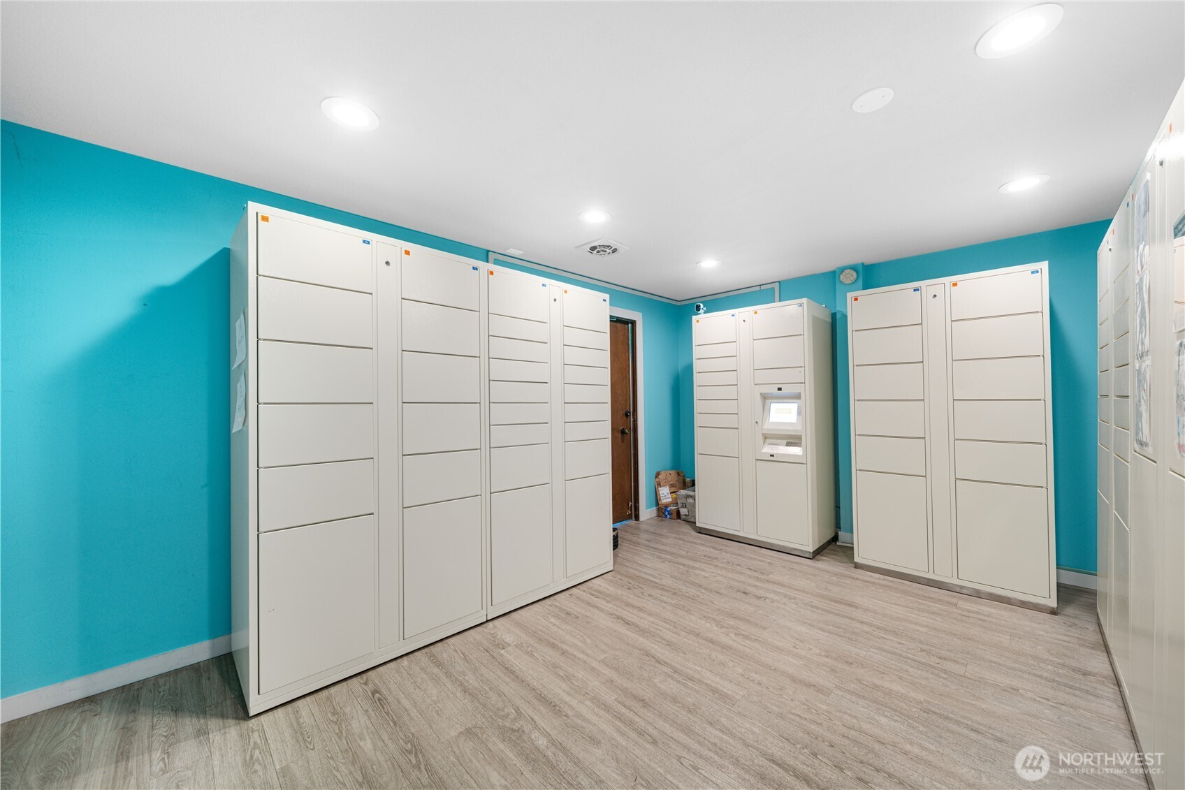7021 Sand Point Way Northeast, Unit B201 Seattle, WA 98115 - Photo 23 of 29 an empty room with closet and wooden floor