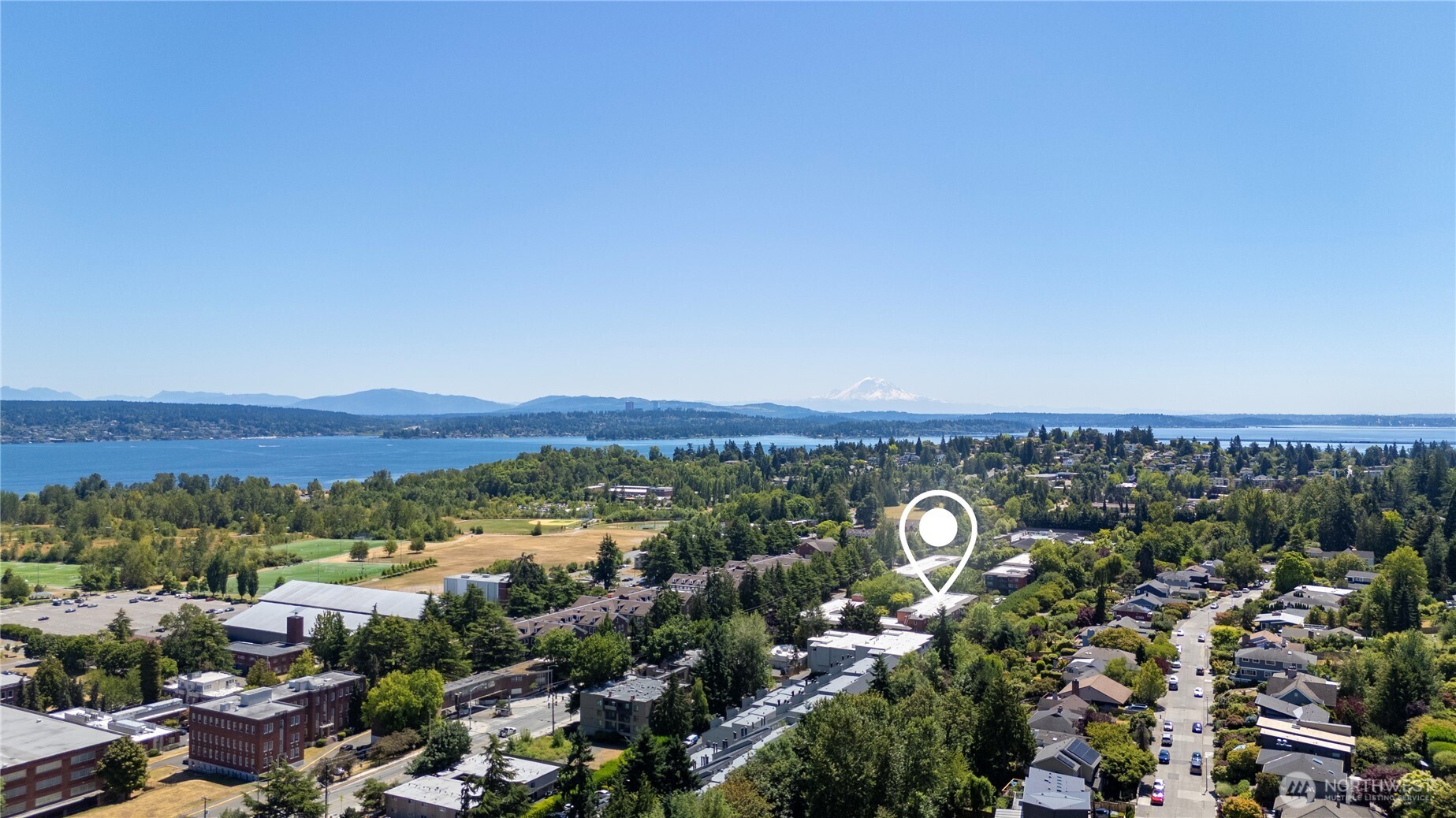 7021 Sand Point Way Northeast, Unit B201 Seattle, WA 98115 - Photo 25 of 29 a view of a city with a mountain in the background
