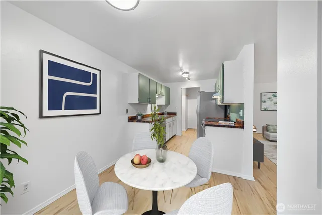 a view of a dining room with furniture and window