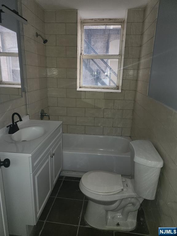 316 South Orange Avenue, Unit BS Newark, NJ 07103 - Photo 6 of 7 a bathroom with a toilet sink and bathtub