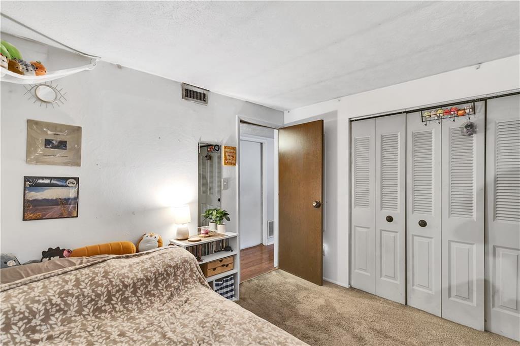 241 Coxcomb Hill Road, Unit 30 New Kensington, PA 15068 - Photo 11 of 16 a bedroom with a bed and a dresser