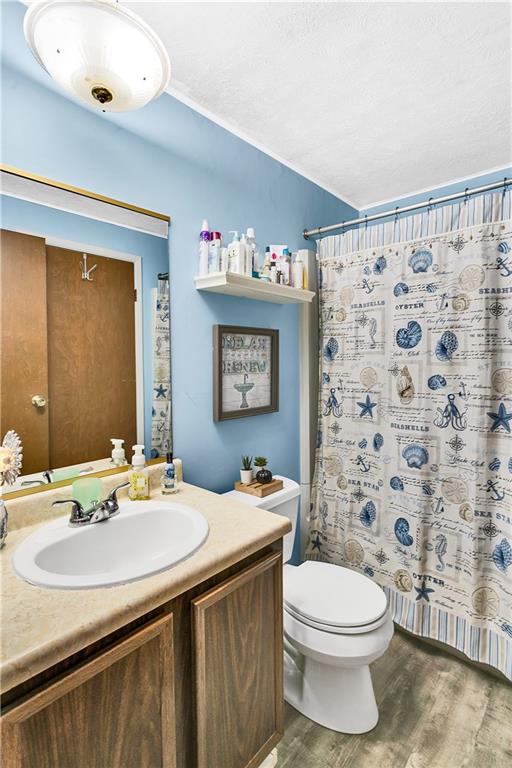 241 Coxcomb Hill Road, Unit 30 New Kensington, PA 15068 - Photo 15 of 16 a bathroom with a sink a toilet and a mirror