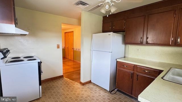 4202 Black Rock Road Hampstead, MD 21074 - Photo 14 of 30 a kitchen with a refrigerator sink and stove