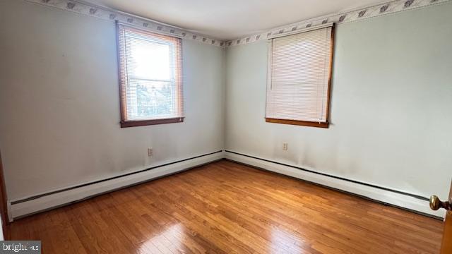 4202 Black Rock Road Hampstead, MD 21074 - Photo 19 of 30 a view of an empty room with wooden floor and a window