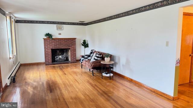 4202 Black Rock Road Hampstead, MD 21074 - Photo 7 of 30 a living room with furniture and a fireplace