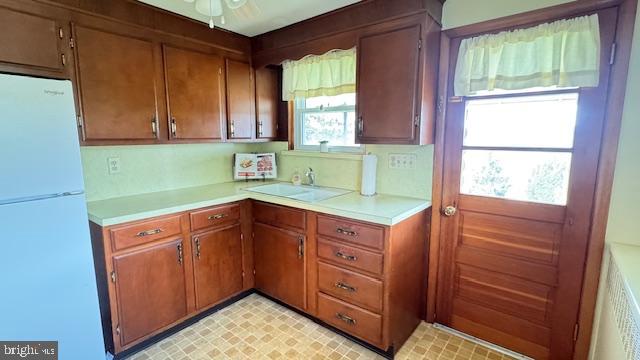4202 Black Rock Road Hampstead, MD 21074 - Photo 8 of 30 a kitchen with wood cabinets and a window