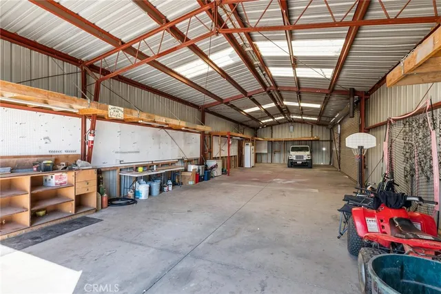a view of empty room with wooden ceiling