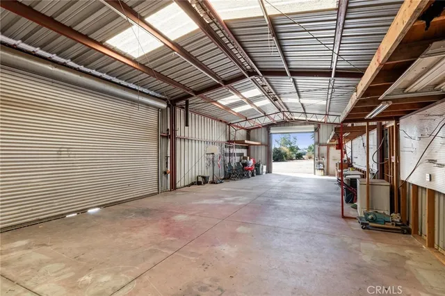 an aerial view of a house with a yard and lake view