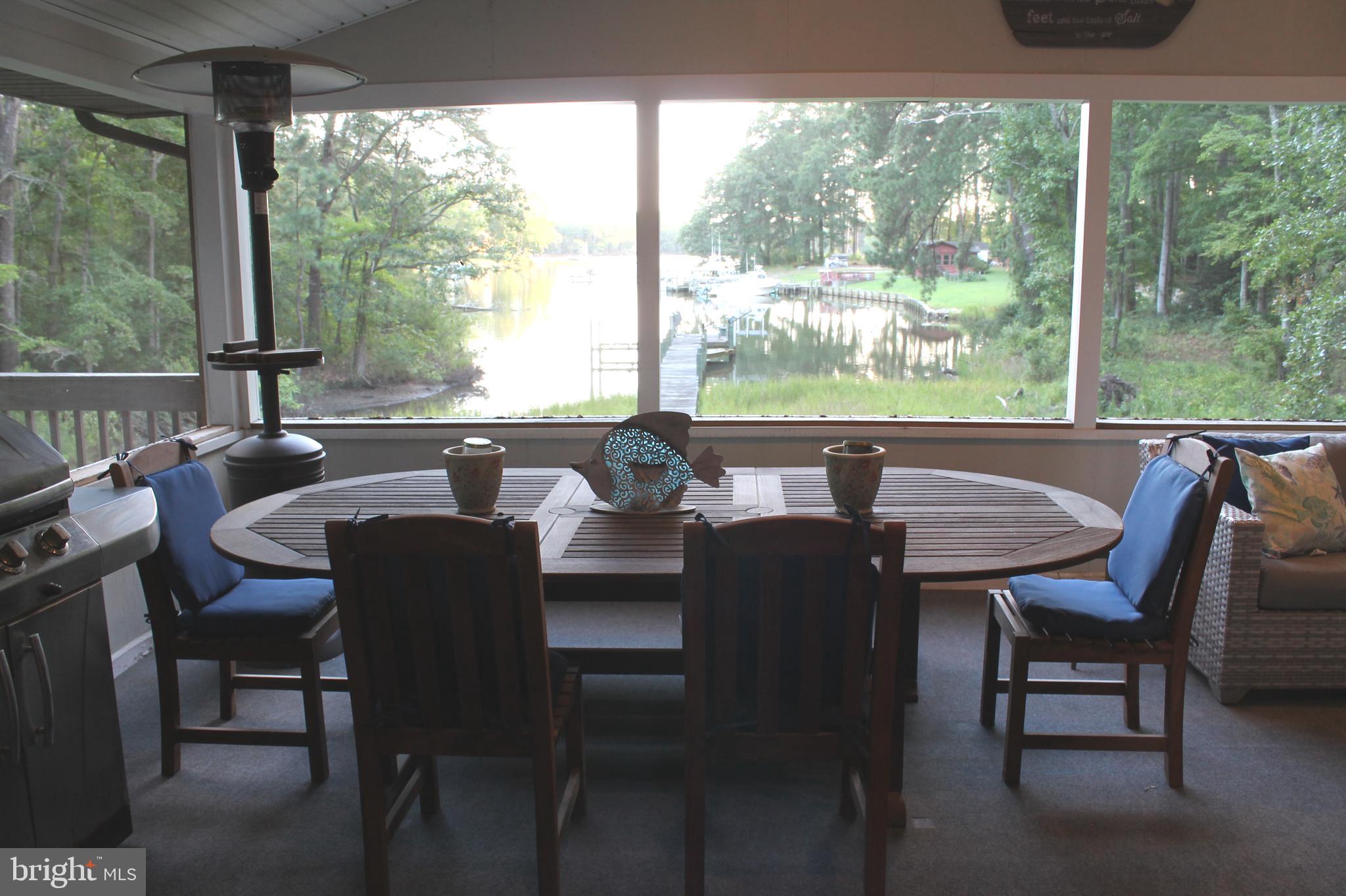 306 Liberty Road Reedville, VA 22539 - Photo 13 of 43 Outdoor dining on screened porch