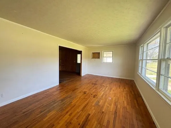 a view of a living room with a wooden floor