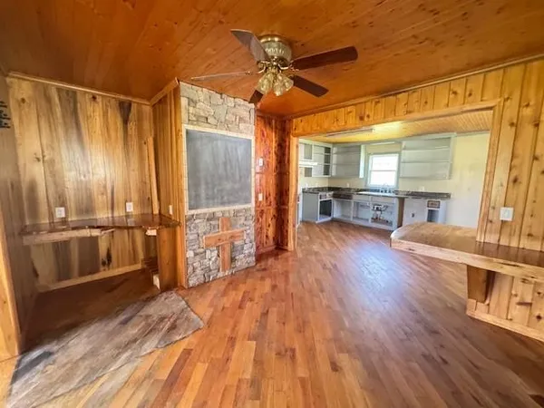 a view of a room with a ceiling fan