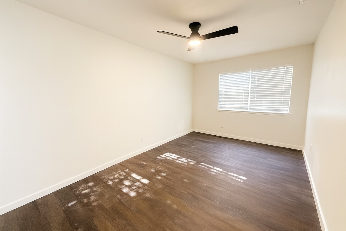 1015 East Yager Lane, Unit 51 Austin, TX 78753 - Photo 9 of 11 a view of an empty room with a window