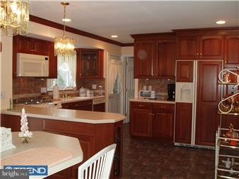 2401 Berkley Road Reading, PA 19605 - Photo 3 of 6 a kitchen with stainless steel appliances granite countertop a sink refrigerator and cabinets