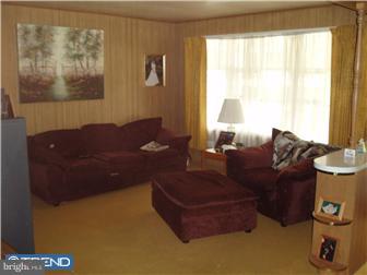 2401 Berkley Road Reading, PA 19605 - Photo 5 of 6 a living room with furniture and a window