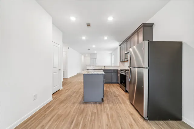 a kitchen with a refrigerator a sink and dishwasher