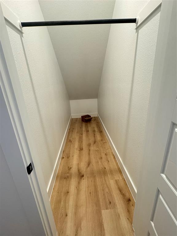 1313 Eureka Spgs Street Prosper, TX 75078 - Photo 4 of 40 Corridor featuring light wood-style flooring and lofted ceiling
