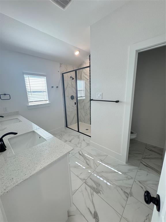 1313 Eureka Spgs Street Prosper, TX 75078 - Photo 6 of 40 Full bathroom with light marble finish flooring, double vanity, and a marble finish shower