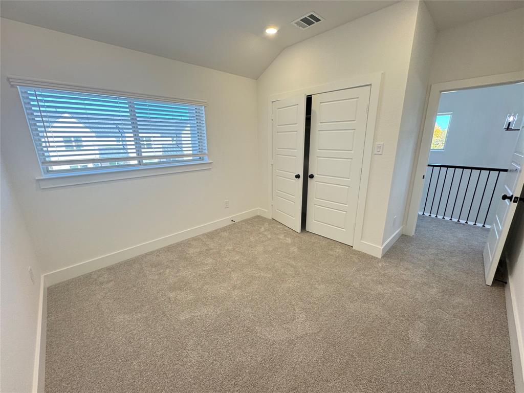 1313 Eureka Spgs Street Prosper, TX 75078 - Photo 9 of 40 Unfurnished bedroom featuring lofted ceiling, a closet, carpet flooring, and recessed lighting