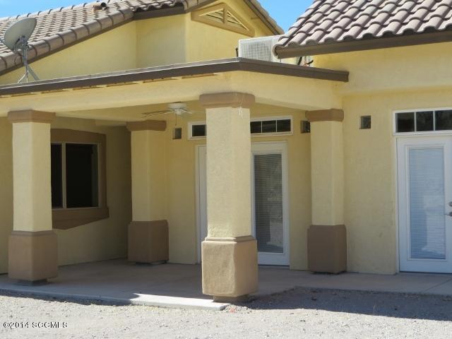 330 Ambrosia Court Rio Rico, AZ 85648 - Photo 8 of 37 a view of a patio with table and chairs