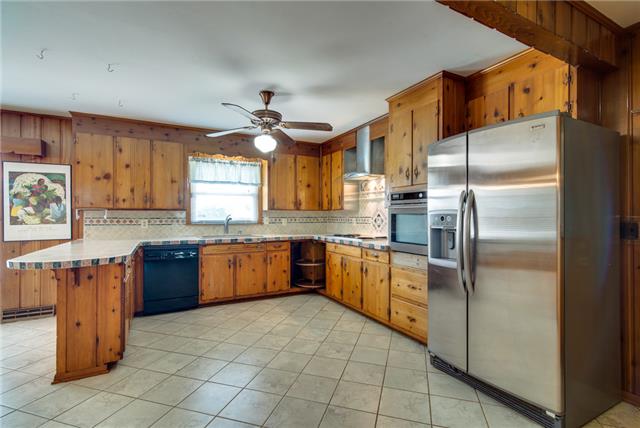 732 Baker Road Smyrna, TN 37167 - Photo 8 of 20 Can you believe the space in this kitchen? Tiled floors, new counters, tiled backsplash and all new SS appliances.