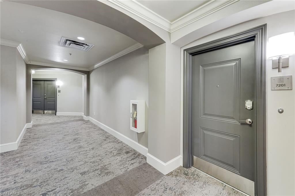 9123 Strada Place, Unit 7201 Naples, FL 34108 - Photo 49 of 50 wooden floor with a bathroom
