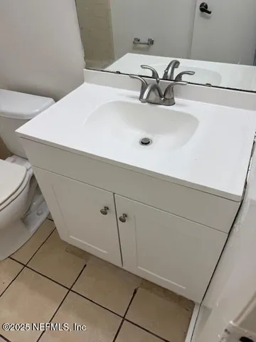 a bathroom with a sink and toilet