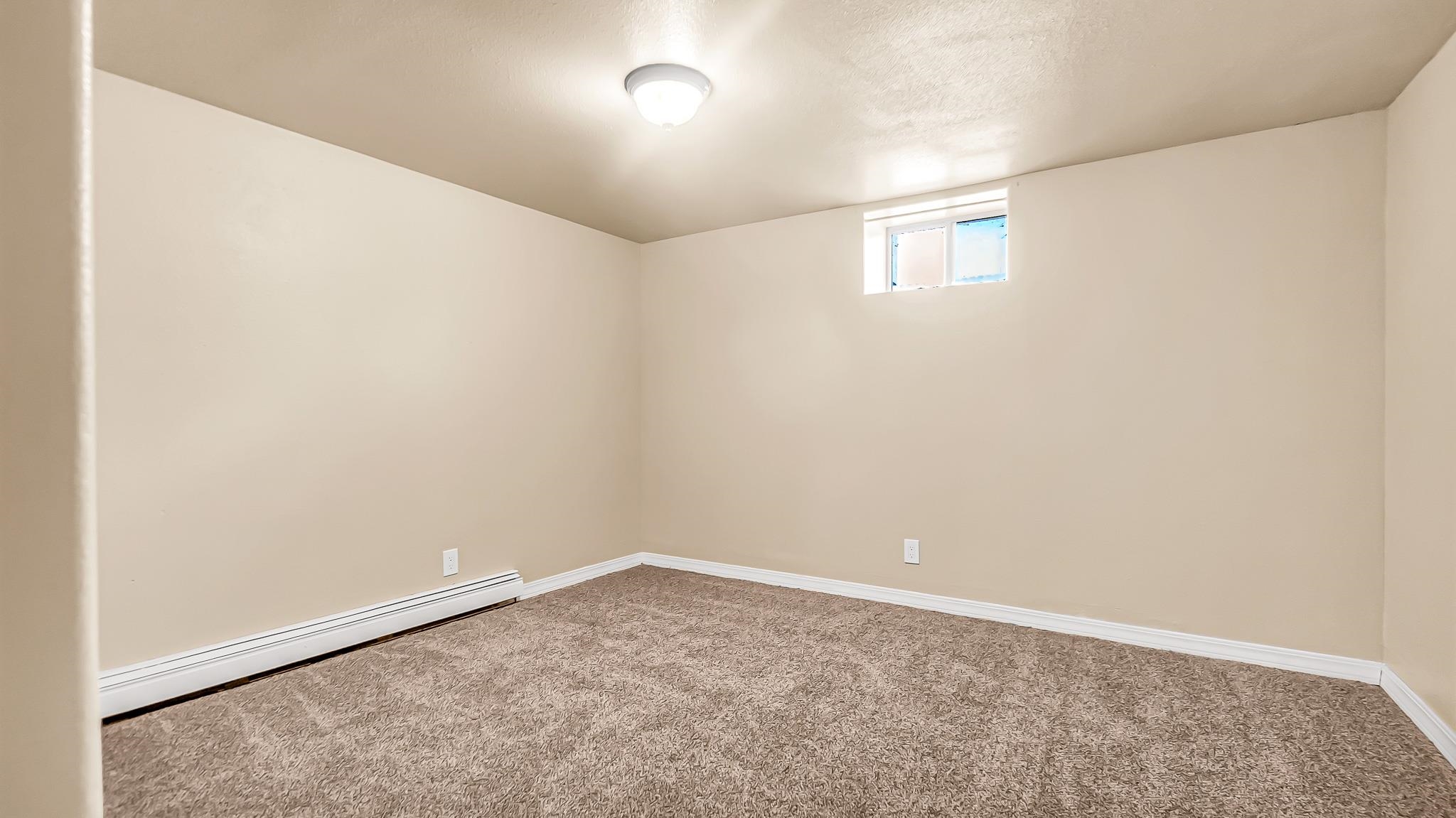 208 3rd Street Parachute, CO 81635 - Photo 25 of 40 an empty room with a empty space and window