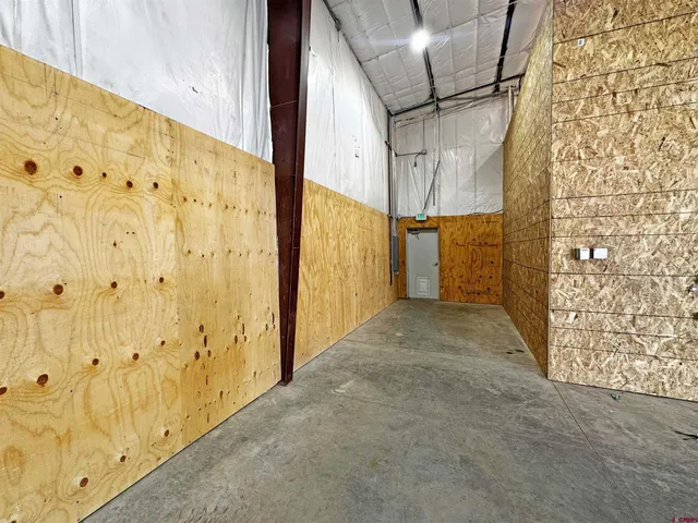 a view of a room with wooden walls