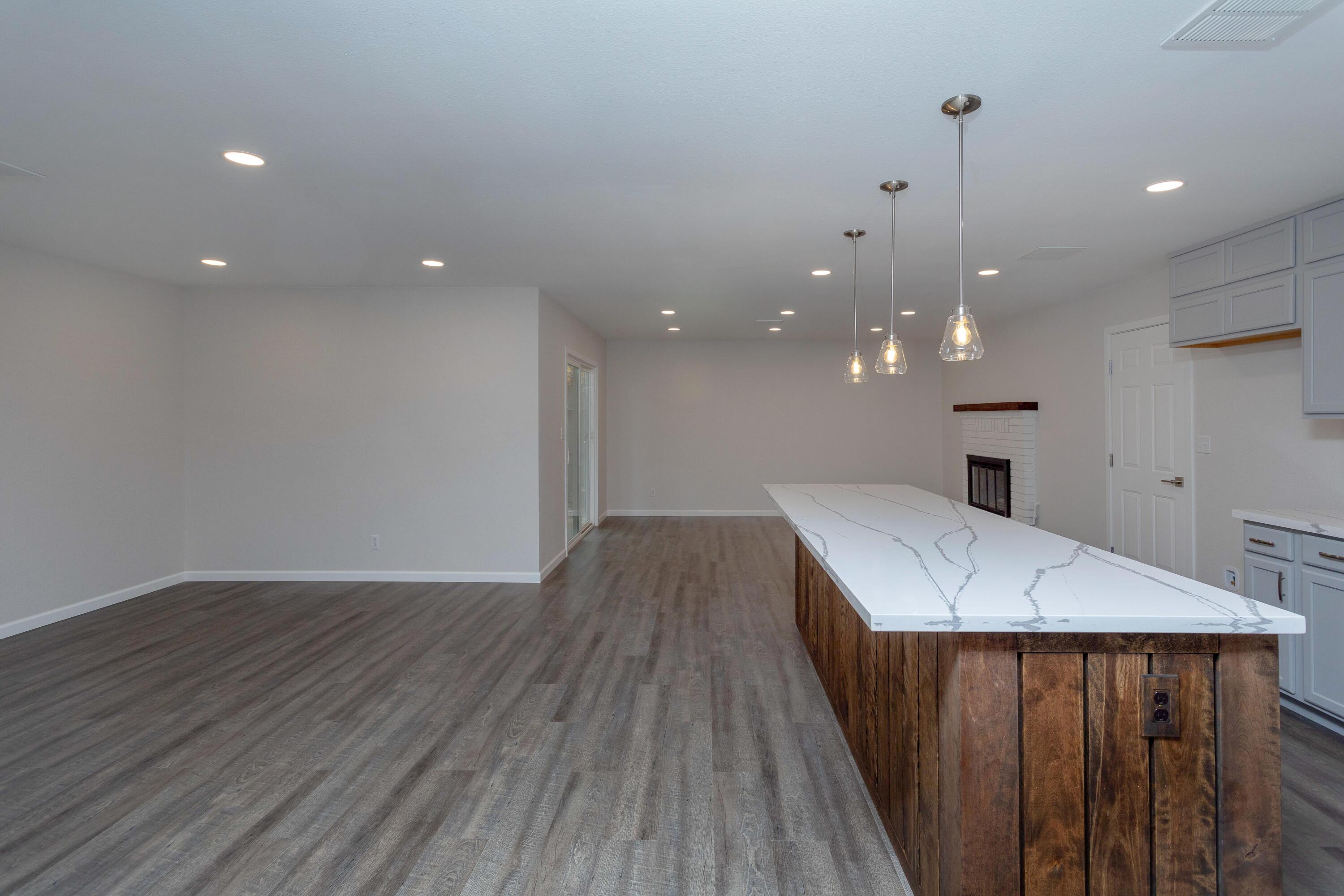 3693 Echo Road Redding, CA 96002 - Photo 9 of 30 a view of a kitchen with a sink and a wooden floor