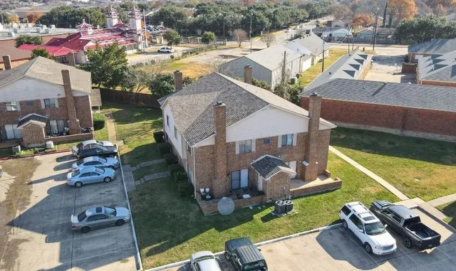 an aerial view of a house with a swimming pool