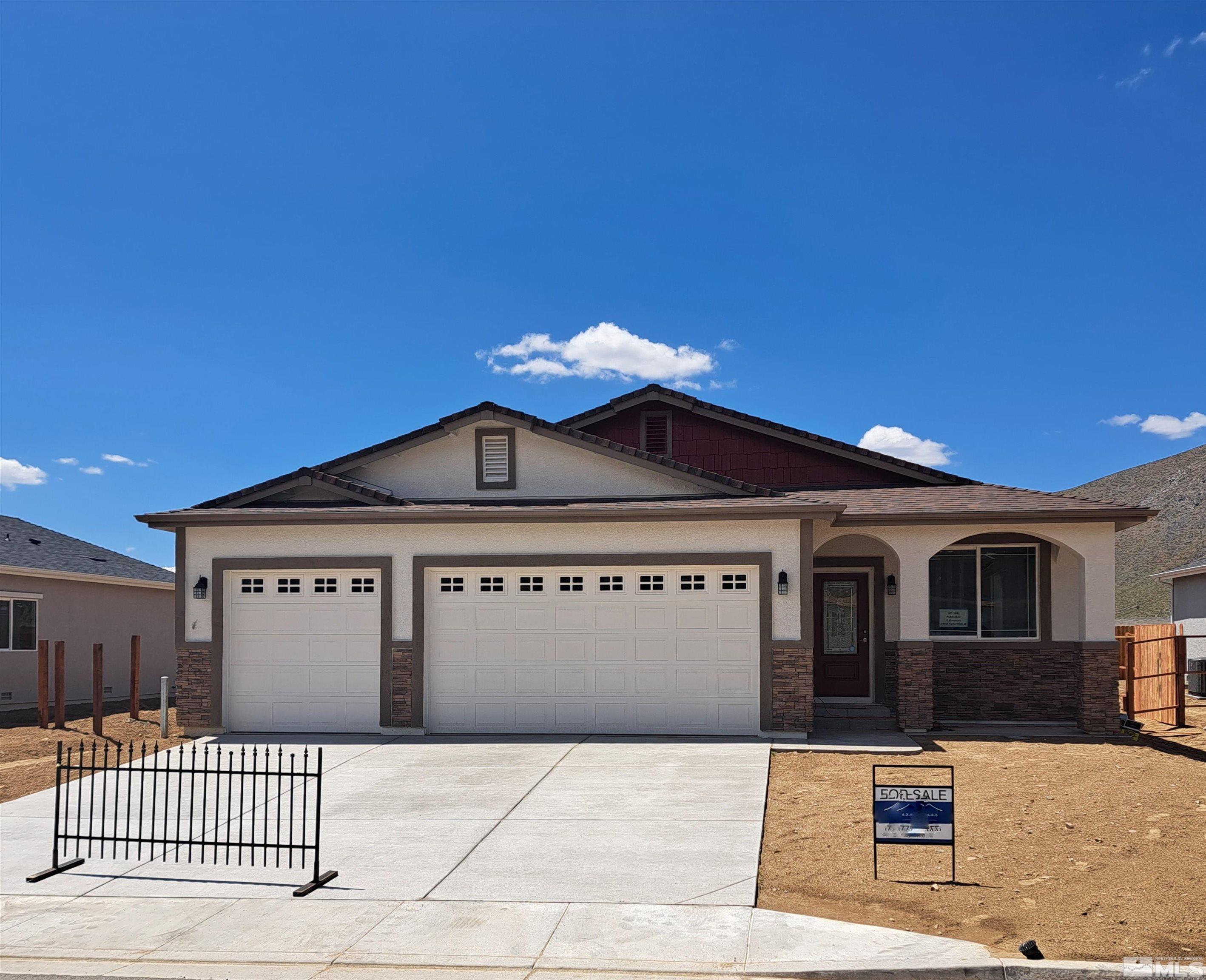19013 Alpine Walk Court, Unit LOT 1881 Reno, NV 89508 - Photo 1 of 26 a front view of a house with a garage