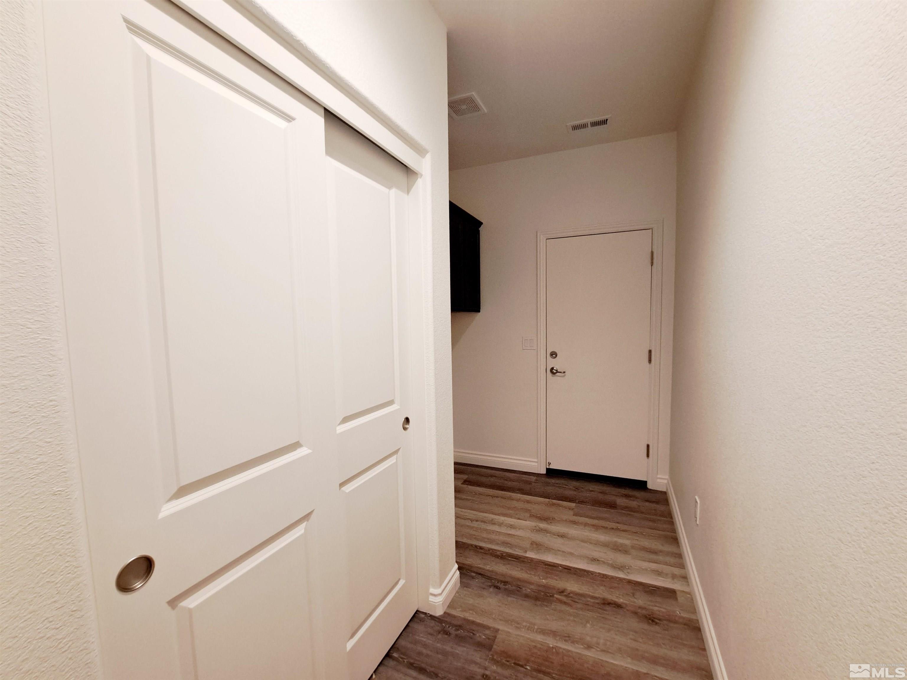 19013 Alpine Walk Court, Unit LOT 1881 Reno, NV 89508 - Photo 11 of 26 a view of a room with wooden floor