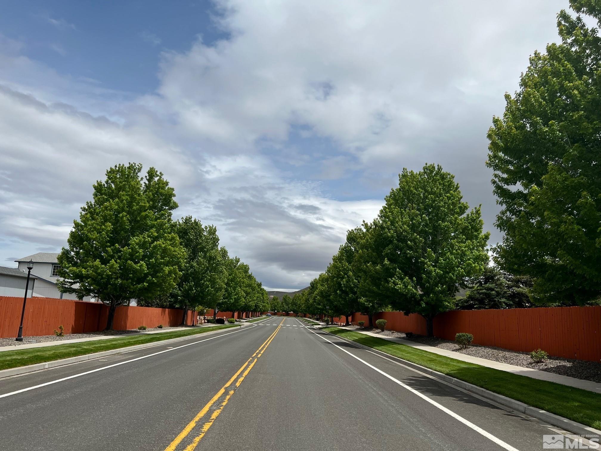 19013 Alpine Walk Court, Unit LOT 1881 Reno, NV 89508 - Photo 23 of 26 a view of a city street and trees