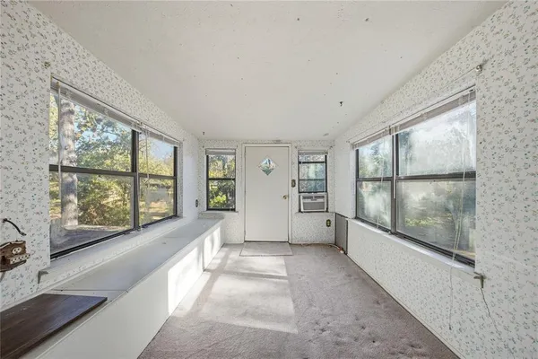 a view of an empty room with a window