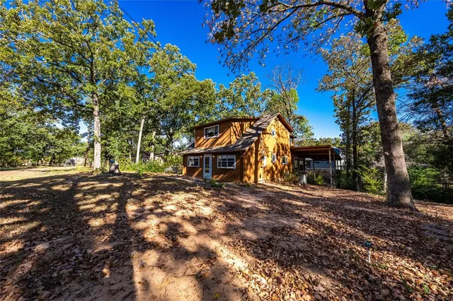 a view of a house with a tree