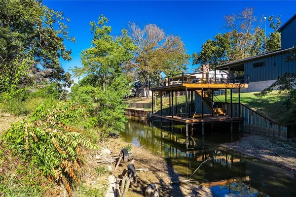 a view of a chairs and table in the patio