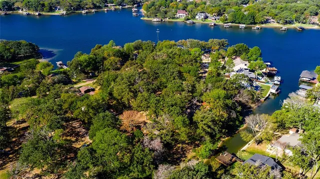 an aerial view of a houses with ocean view