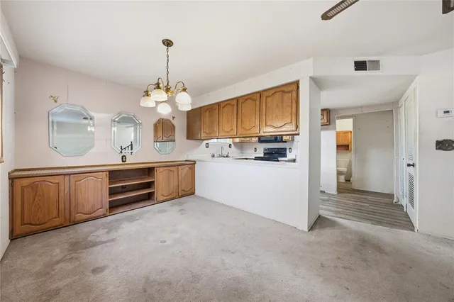 a view of a kitchen with a sink and cabinet area
