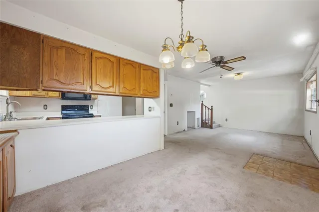 a view of a kitchen with electric appliances