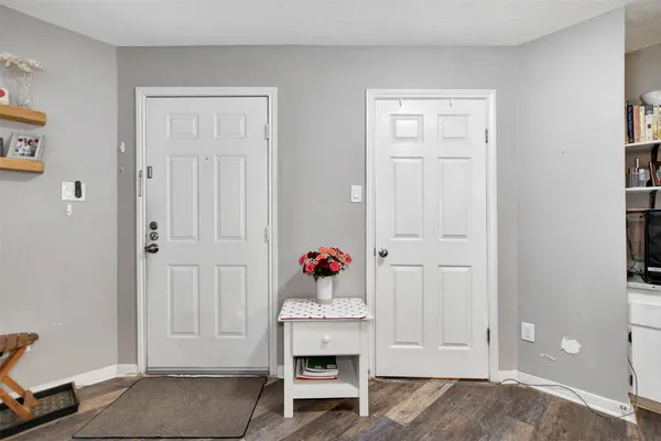 a bedroom with bed and cabinets